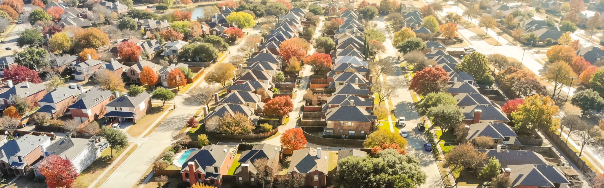 Aerial view row of new house with cul-de-sac (dead-end) and bright orange color fall foliage near Dallas